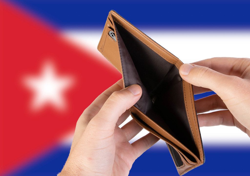 Empty Wallet with Flag of Cuba. Recession and Financial Crisis to come with more debt and federal budget deficit?