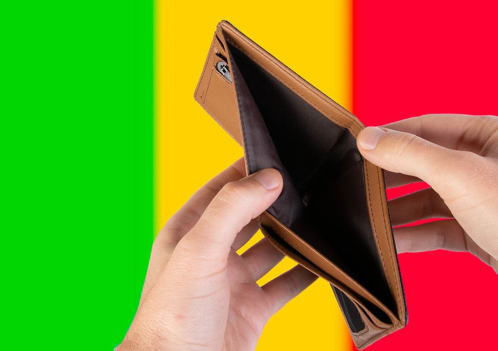 Empty Wallet with Flag of Mali. Recession and Financial Crisis to come with more debt and federal budget deficit?