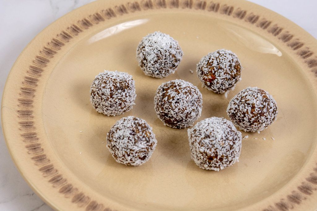 Energy Balls with Dates and Peanut Butter in the Coconut