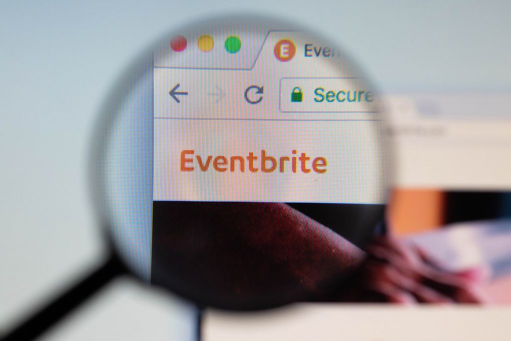 Eventbrite logo on a computer screen with a magnifying glass