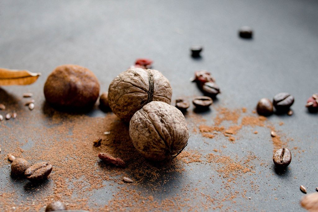Fall compositon- walnuts, coffee beans, leaves and cinnamon