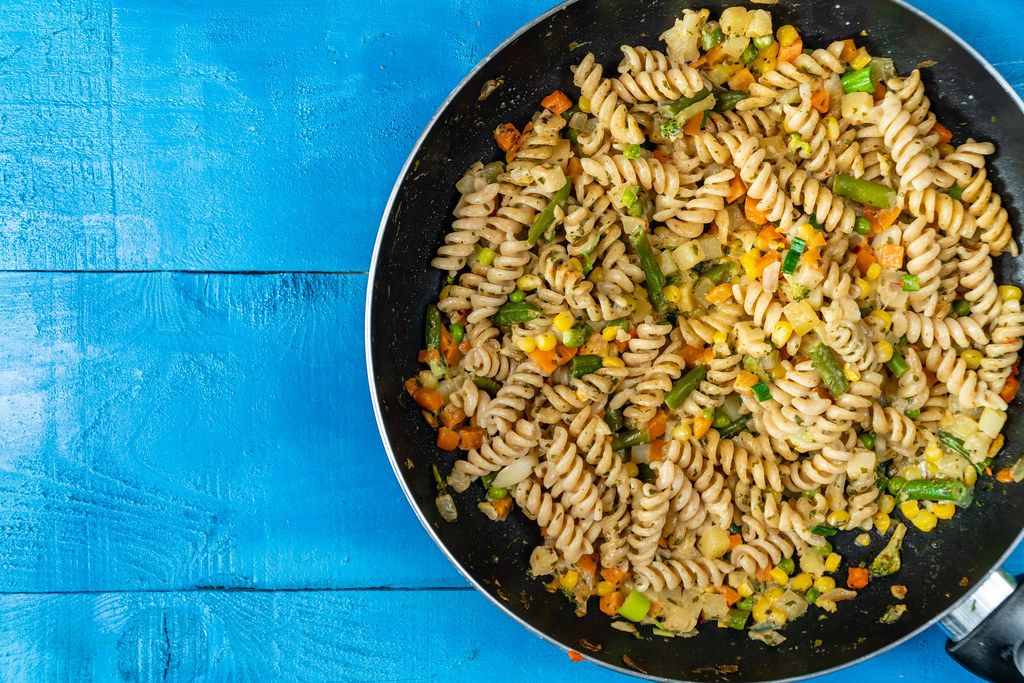 Flat lay above Cooked Vegetables with Pasta with Copy Space