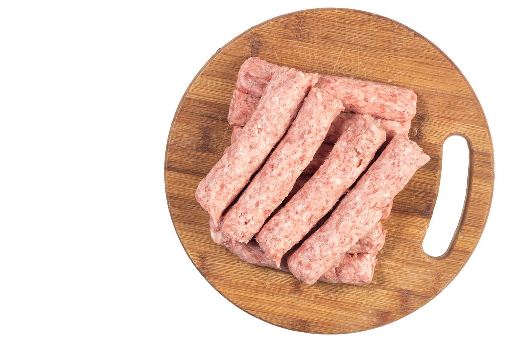 Flat lay above raw Kebabs made of Minced Meat