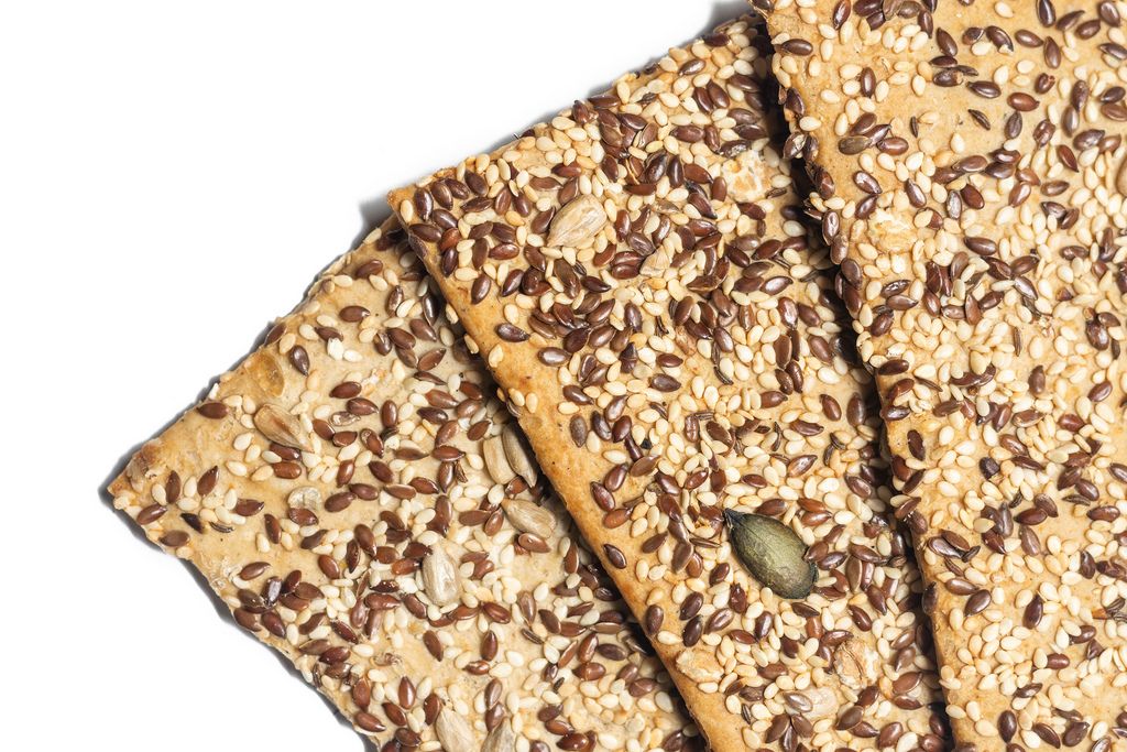 Flax and sunflower seeds healthy food over white background