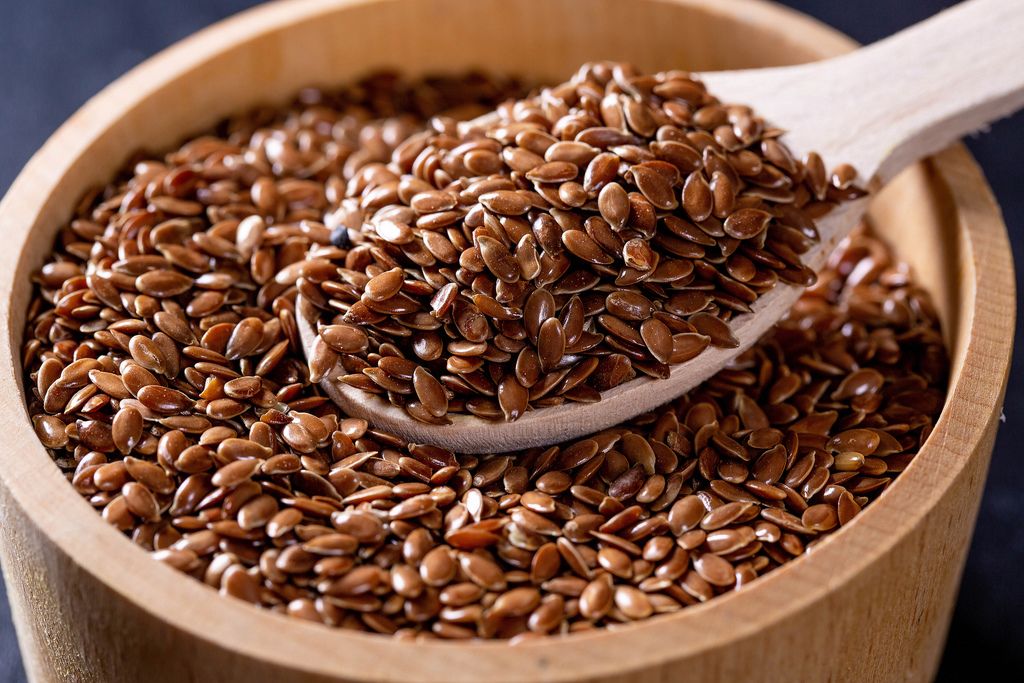 Flax seeds in a wooden bowl