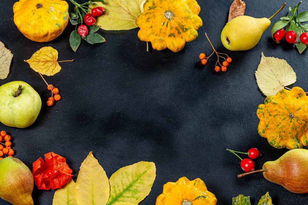 Frame with yellow leaves, fruits, vegetables and berries on black background with free space (Flip 2019)