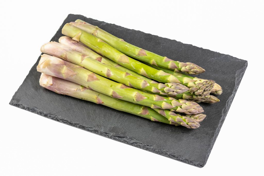 Fresh Asparagus on the black stone tray (Flip 2019)