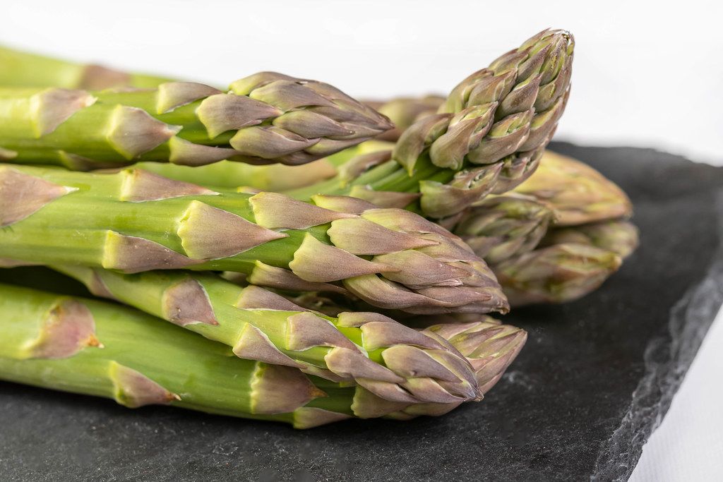 Fresh Asparagus on the black tray (Flip 2019)