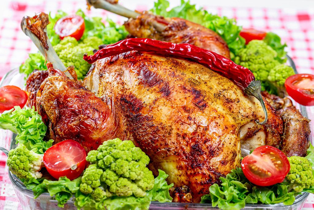 Fresh baked chicken with broccoli, lettuce, tomatoes and chili