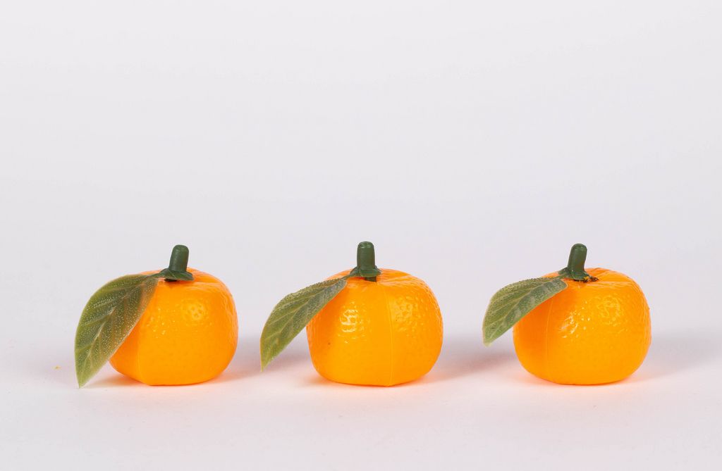 Fresh orange fruits isolated on white background