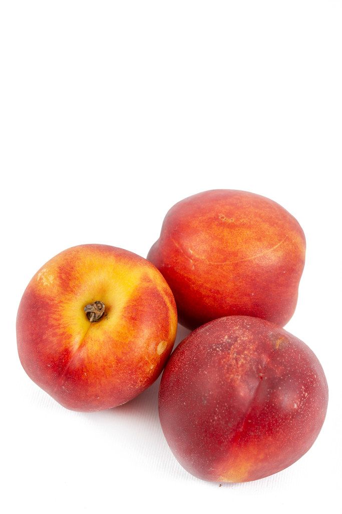 Fresh Peaches with copy space on white background