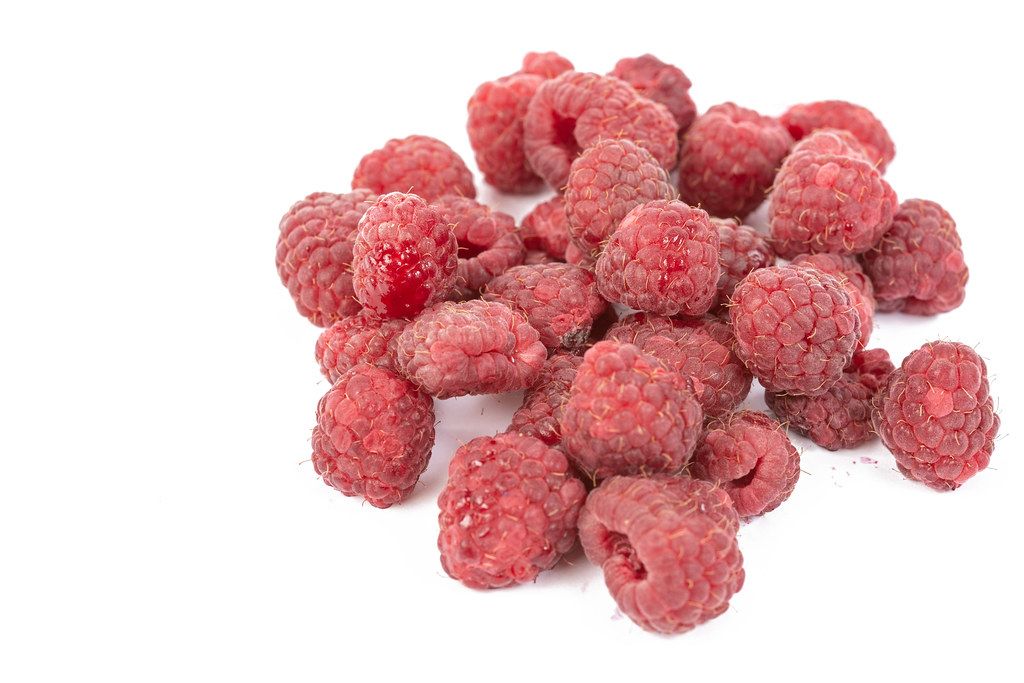 Fresh Raw Raspberries isolated above white background