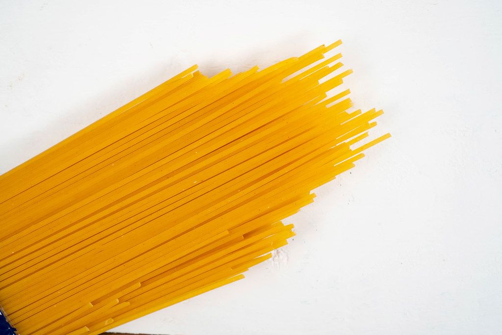 Fresh Raw Spagheti above white background (Flip 2020)