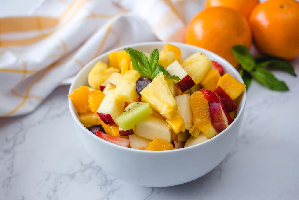 Fruit Salad With Ananas, kiwi, Apples, Strawberries, Orange and Mango ...