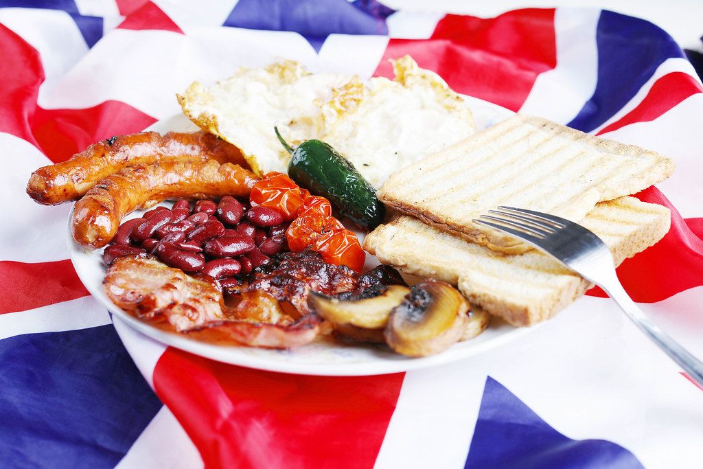 Full English breakfast, traditional meal, UK national flag background
