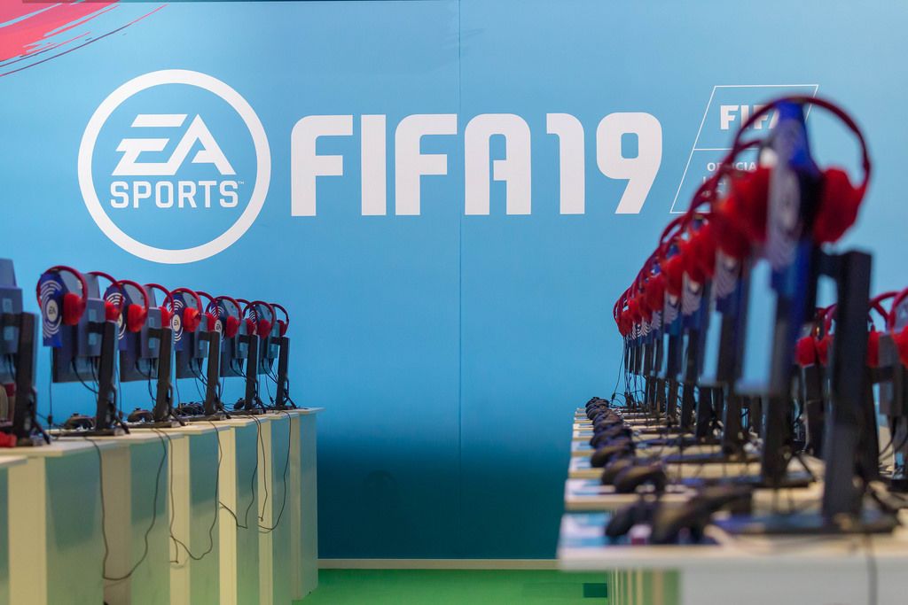 Gaming PCs with red headphones at the EA FIFA19 booth