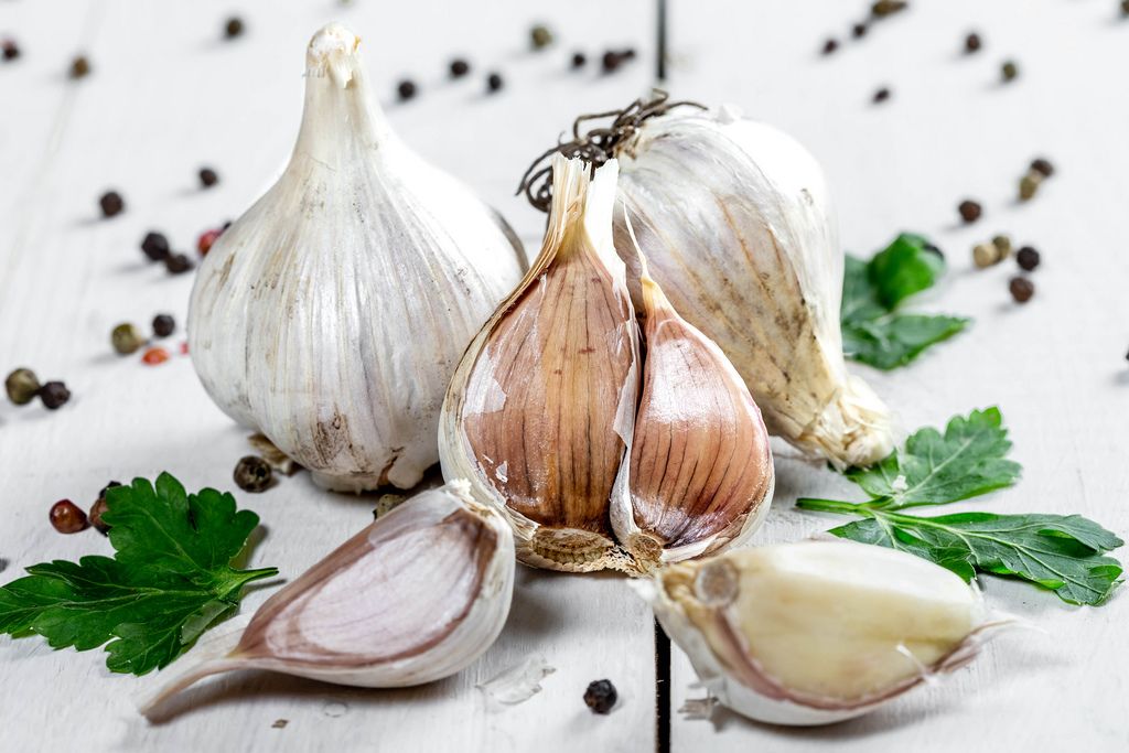 garlic, parsley and pepper on white wooden background (Flip 2019) (Flip 2019) Flip 2019