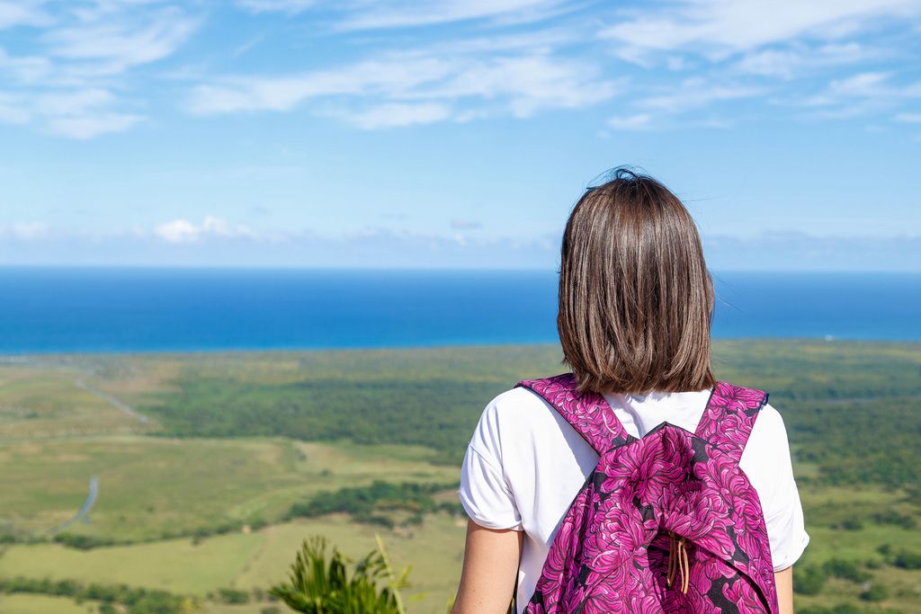 Girl with backpak looks to the ocean from Redonda mountine at Dominican Republic (Flip 2019) (Flip 2019) Flip 2019