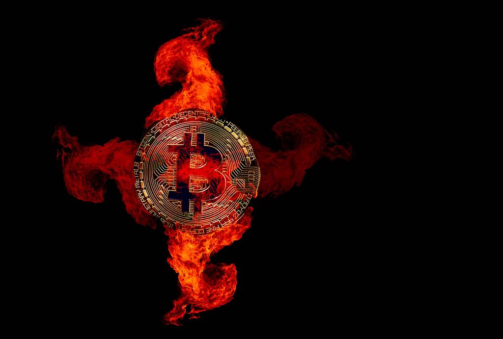Golden Bitcoin in fire flames