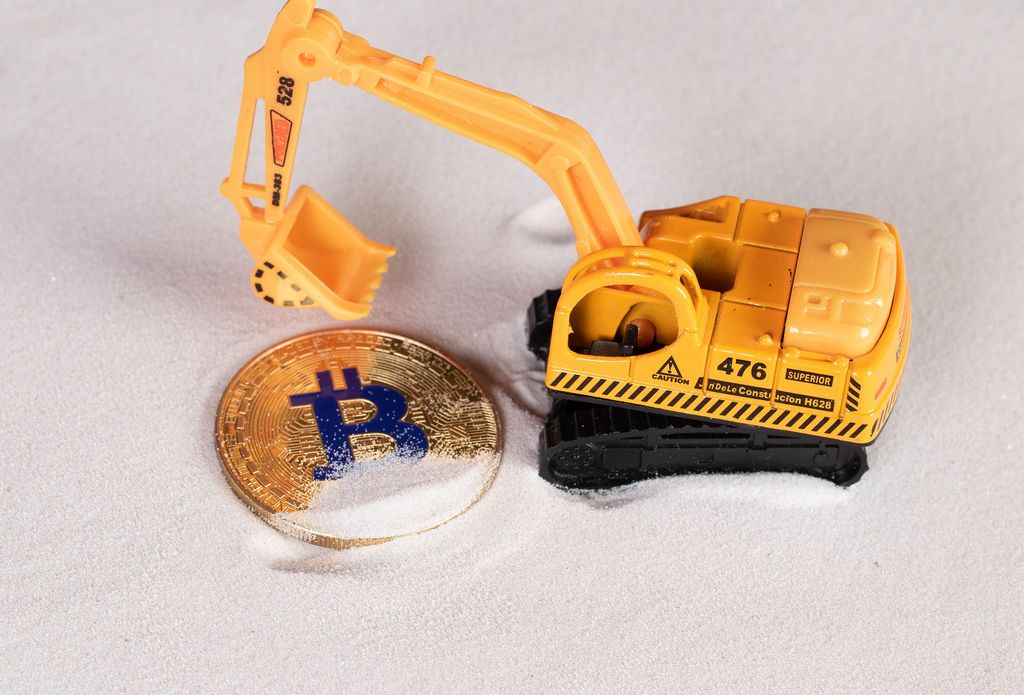 Golden Bitcoin with excavator