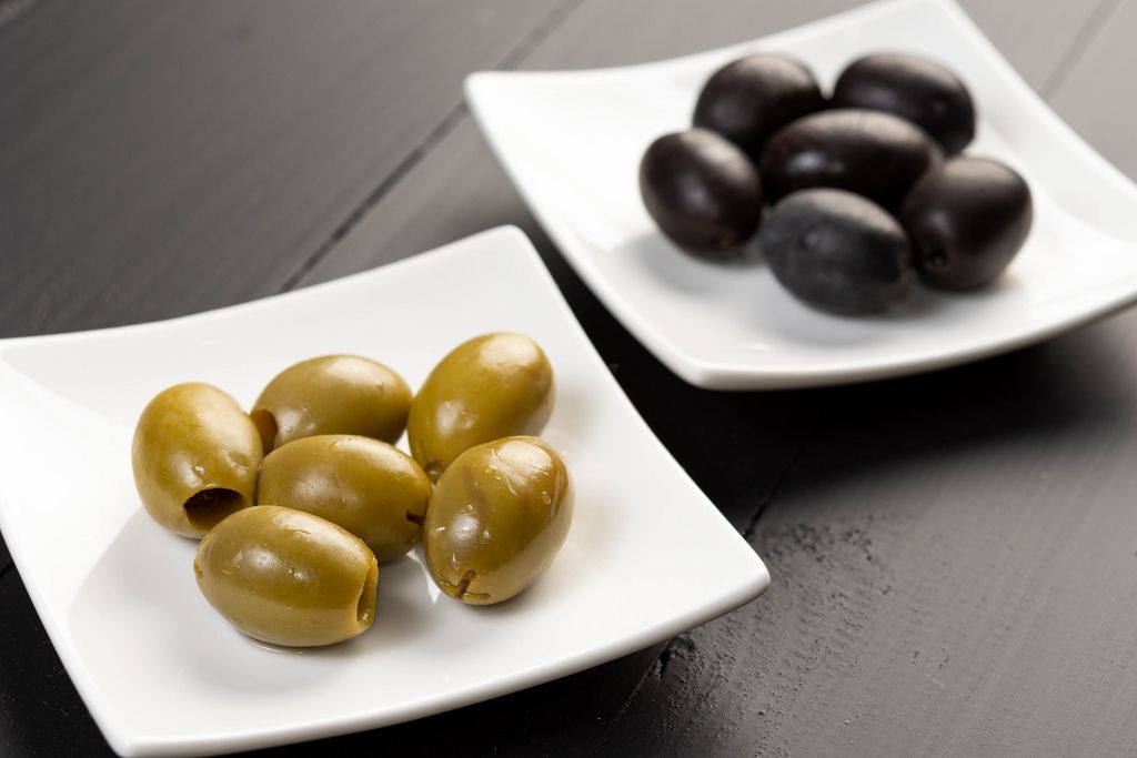 Green and Black Olives on the plate