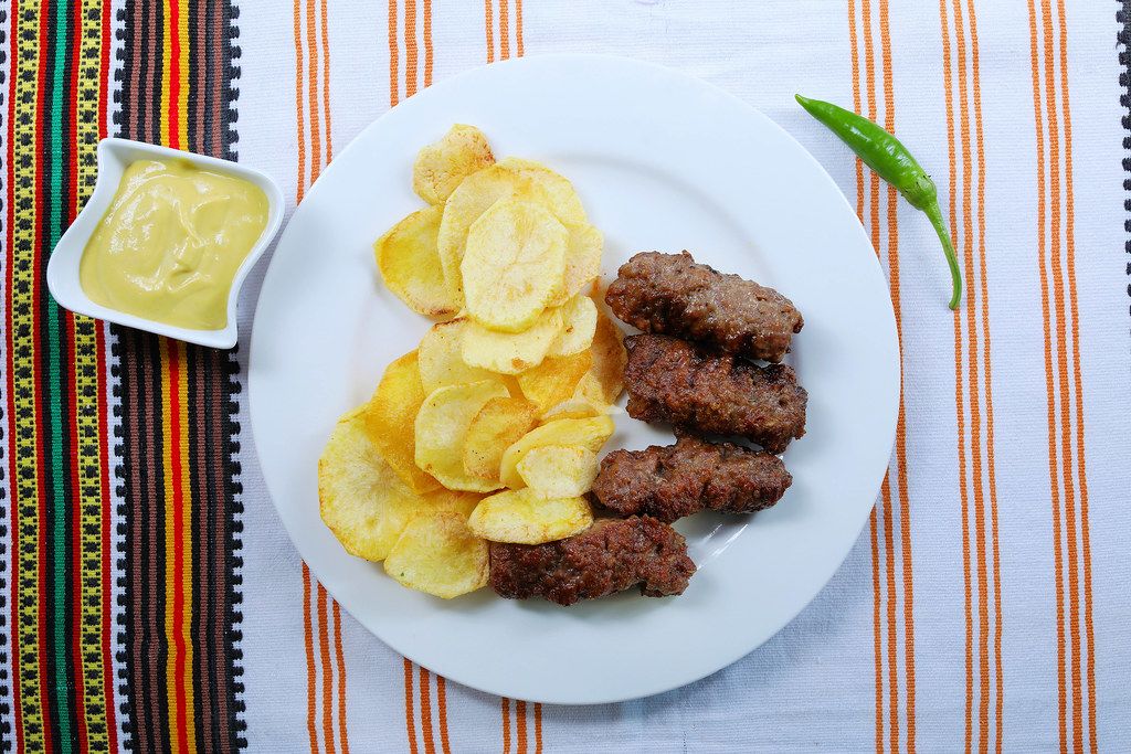 Grilled minced meat rolls with fried potatoes and mustard (Flip 2019)