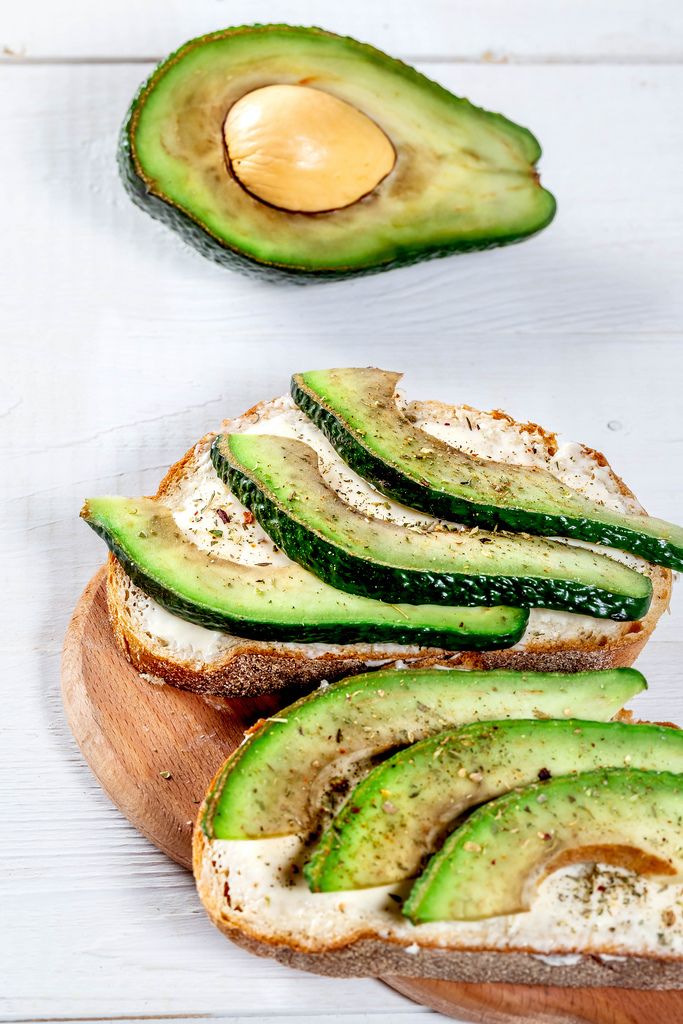 Healthy food-avocado sandwich with cheese on the kitchen Board