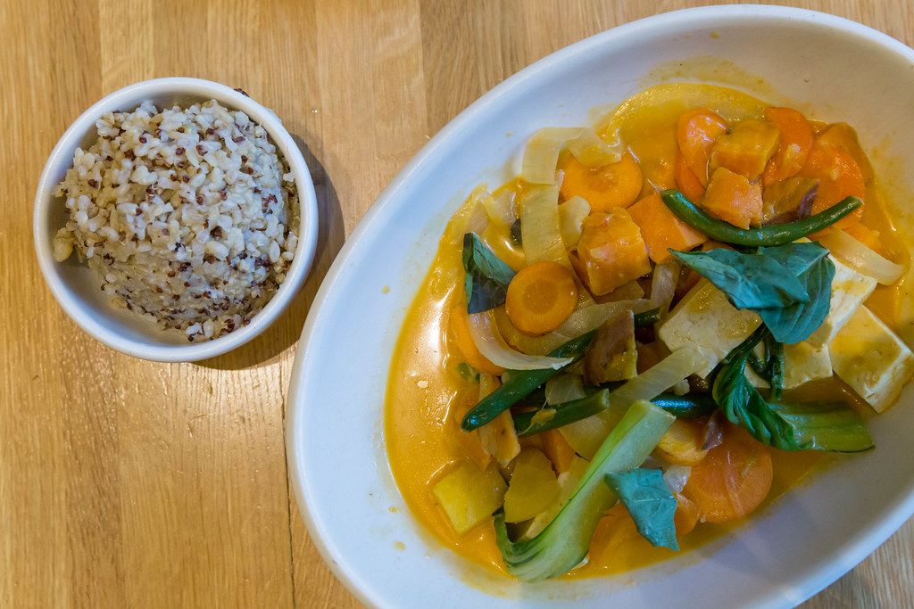 Healthy, seasonal food in Chicago: True Food Kitchen's Spicy Panang Curry. A gluten-free bowl with sweet potato, green bean, bok choy, rainbow carrot, thai basil, coconut curry broth