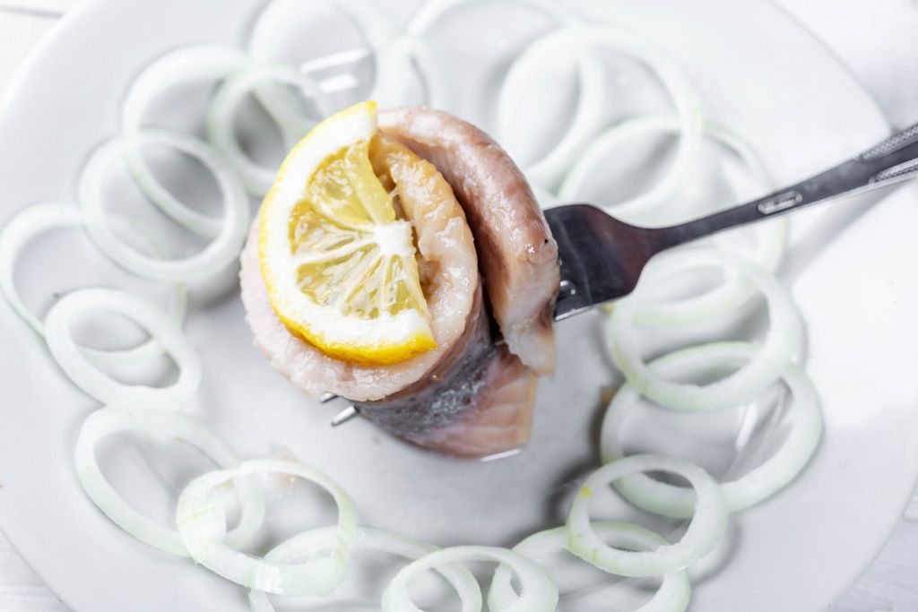 Herring marinated fillet with onion and lemon