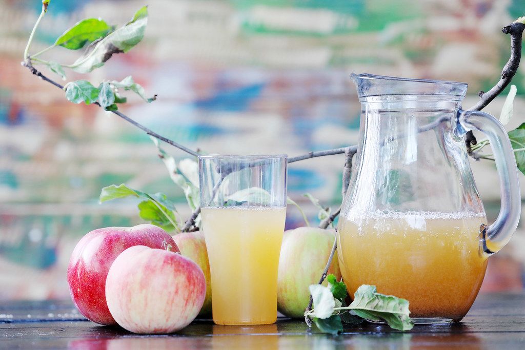 Homemade apple juice with apples on the table (Flip 2019)