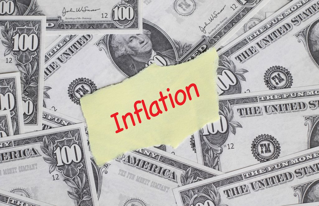 Inflation text with US dollar banknotes