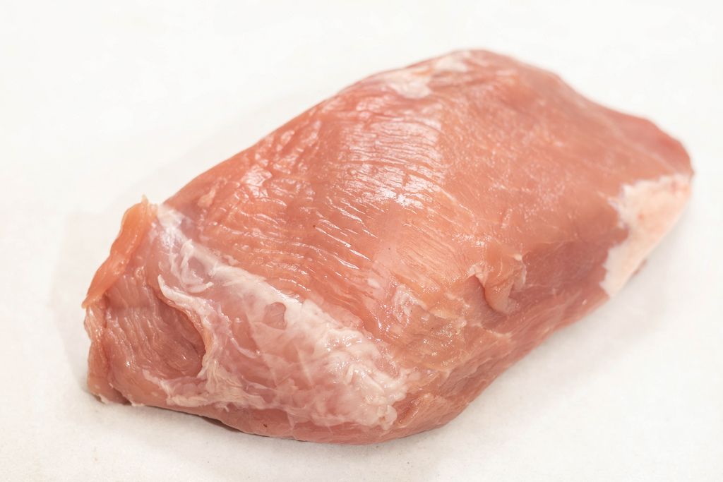 Isolated raw pork meat above white background