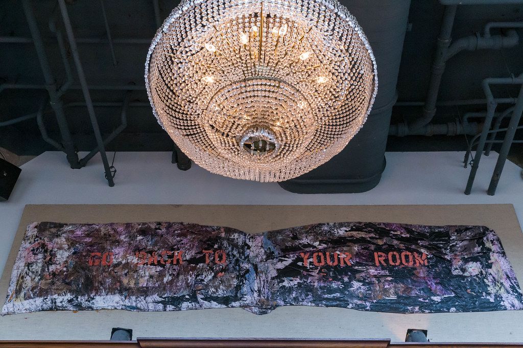 Large chandelier and art on display at historic The Allis restaurant in Chicago