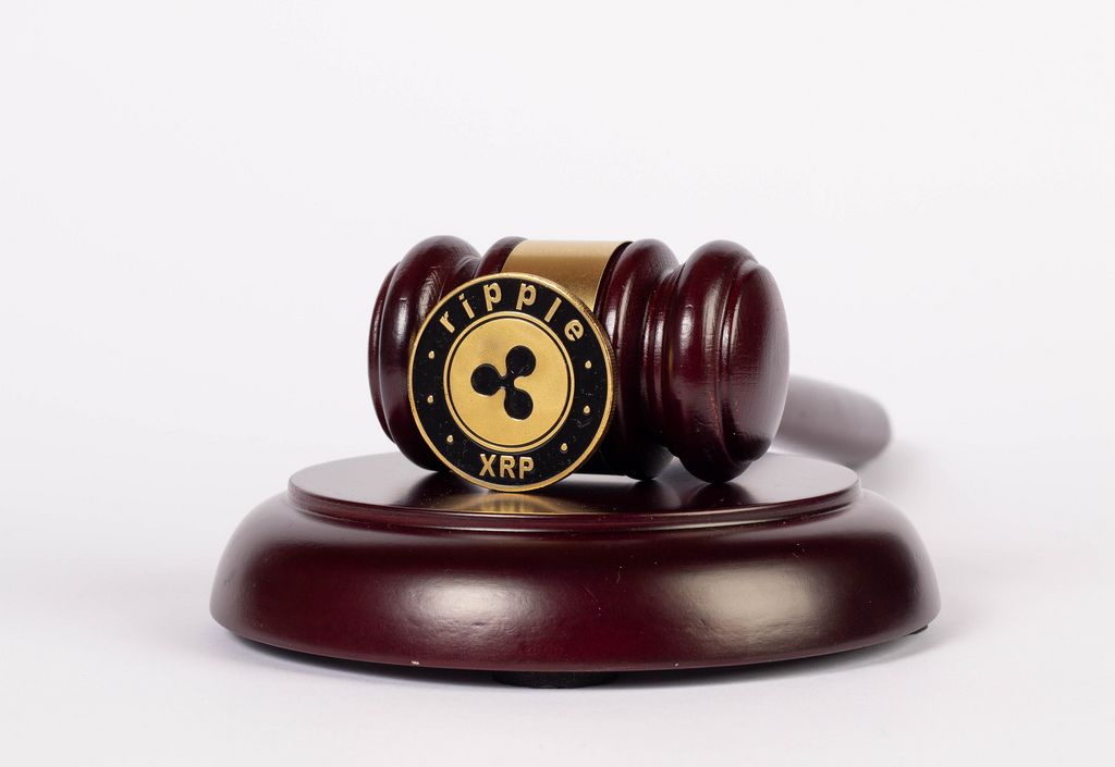 Law gavel and Ripple coin