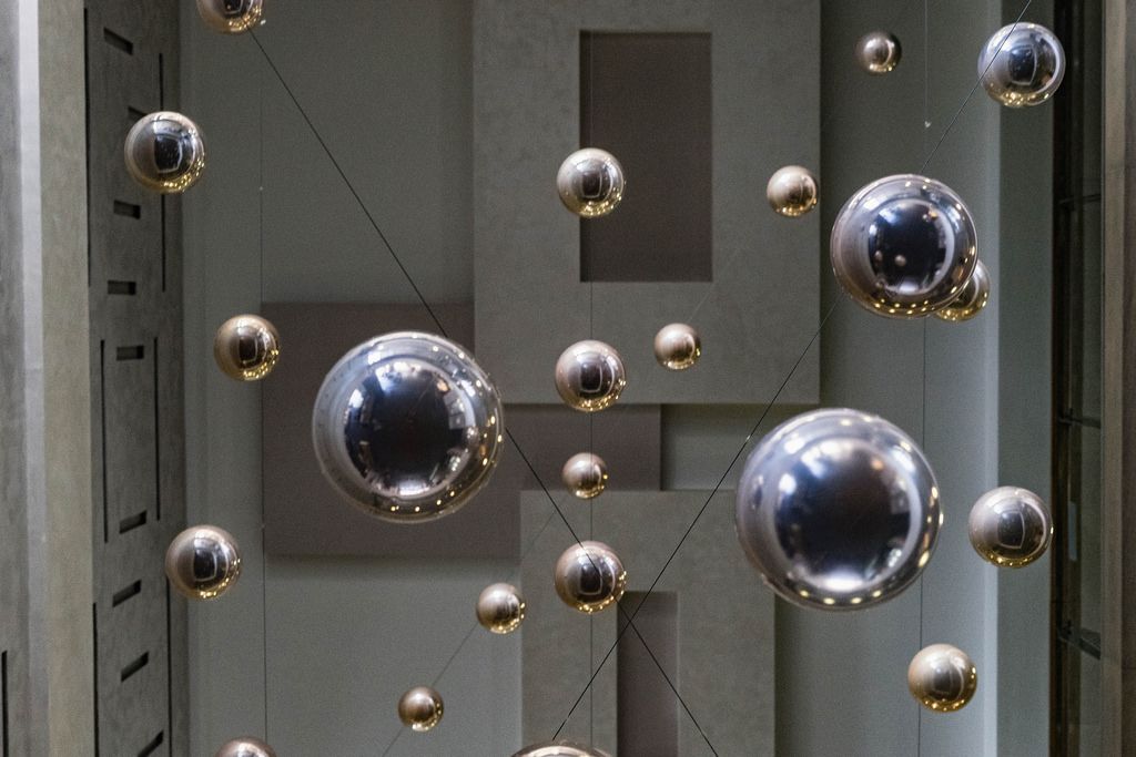 Low Angle View Of The Silver Metal Shiny Balls Hanging From
