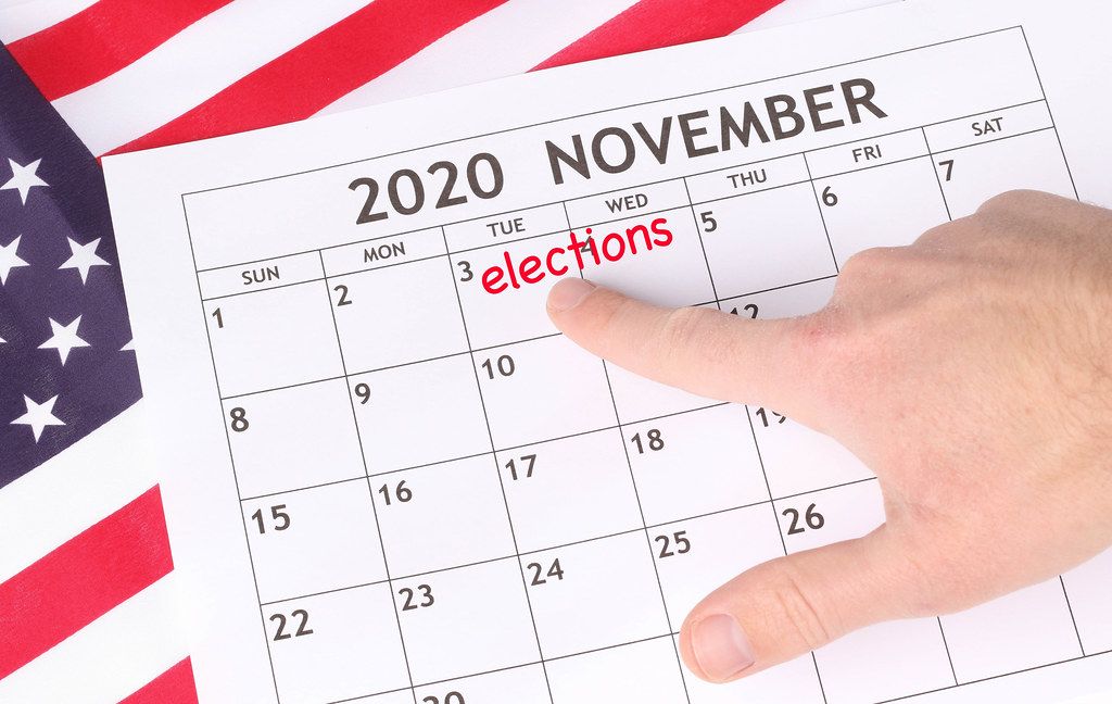 Man pointing date 3rd November 2020 marked in calendar