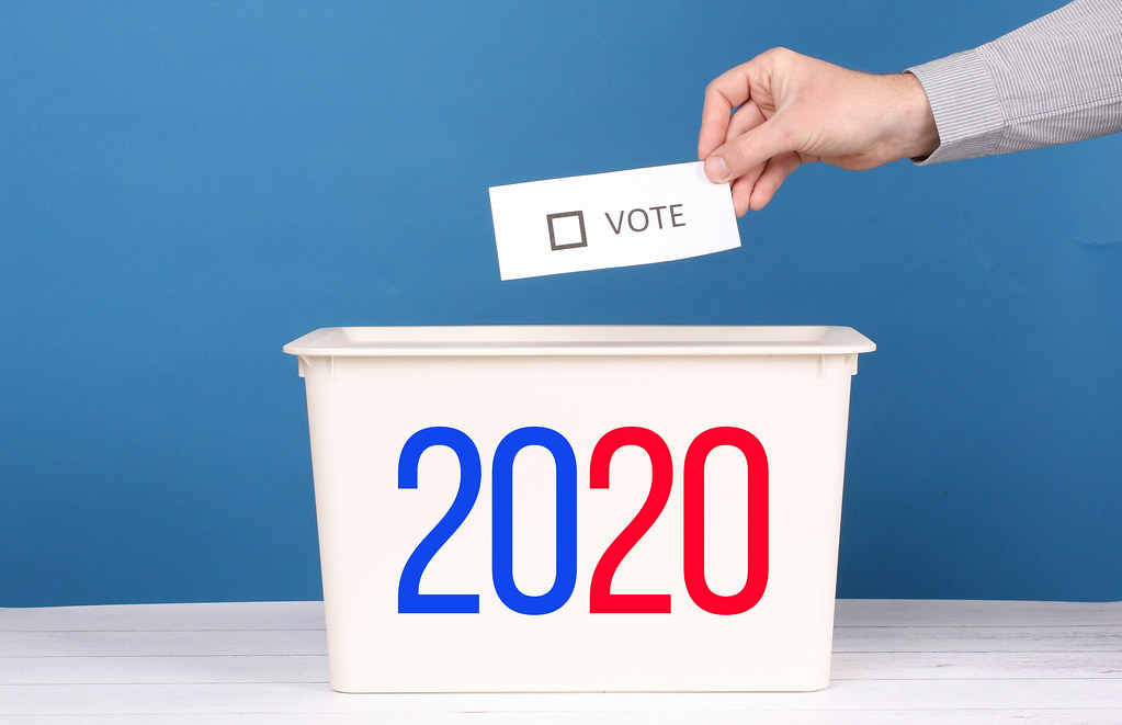 Man putting his vote in the ballot box for  Election 2020
