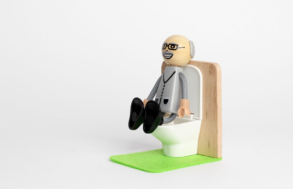 Man Sitting On Bathroom Vanity