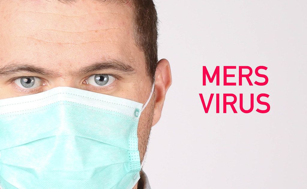 Man wearing face mask on white background with Mers Virus text