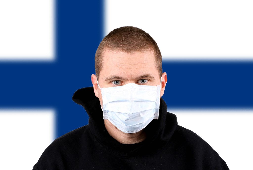 Man wearing protection face mask with flag of Finland