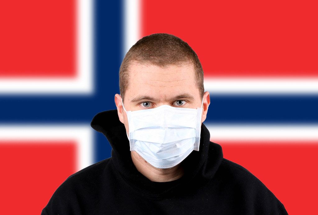 Man wearing protection face mask with flag of Norway