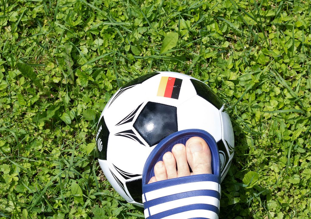 Man's foot touching soccer ball