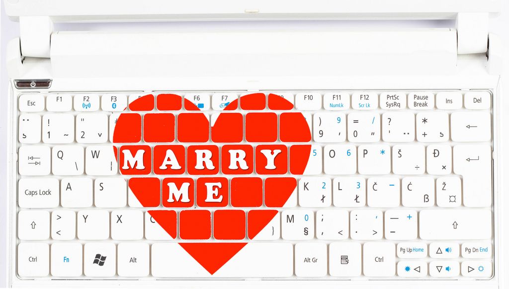 Marriage proposal and love concept for Valentine`s day on computer keyboard