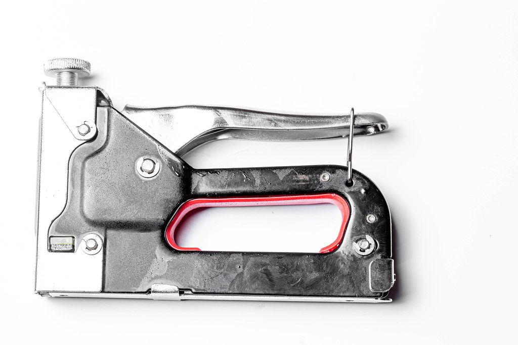 Metal manual stapler on a white background (Flip 2020)