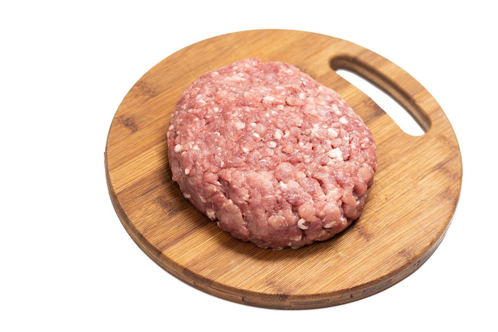 Minced Meat on the kitchen wooden board