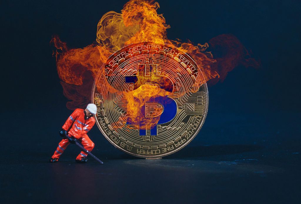 Miner with Bitcoin in flames