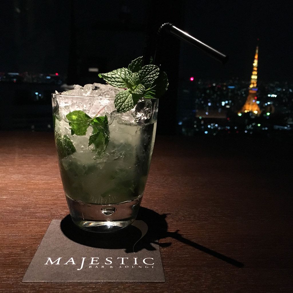 Mojito Cocktail with crushed ices and mint leaves in the Majestic Bar with a view of Tokyo at night