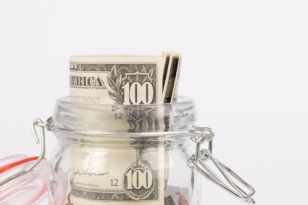 Money in glass jar