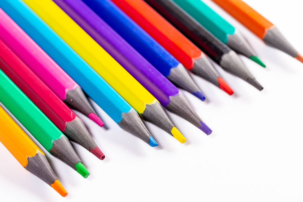 Multicolored pencils on white background (Flip 2019)
