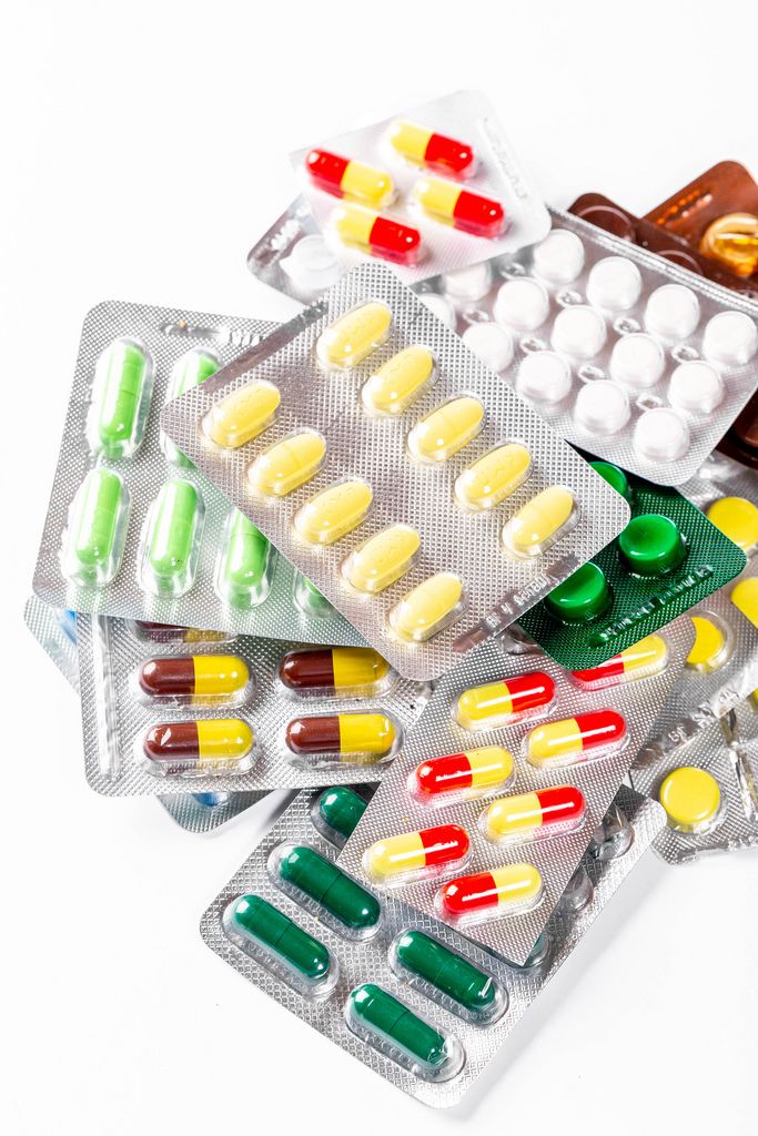 Multicolored tablets, capsules and pills in packages